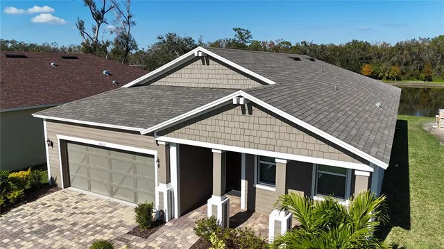 a view of house with yard