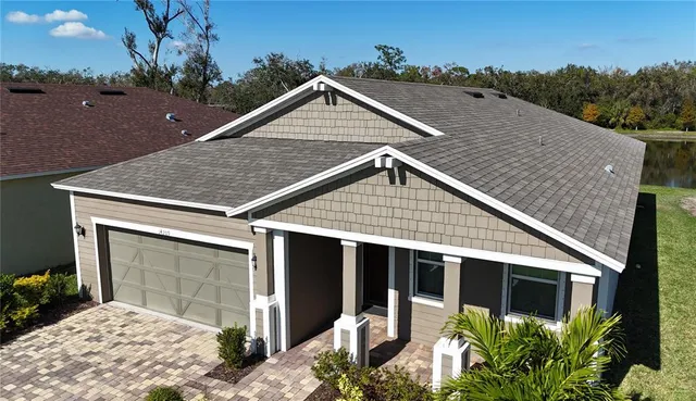 a view of house with yard
