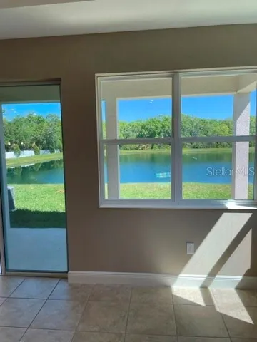 a view of an empty room and window