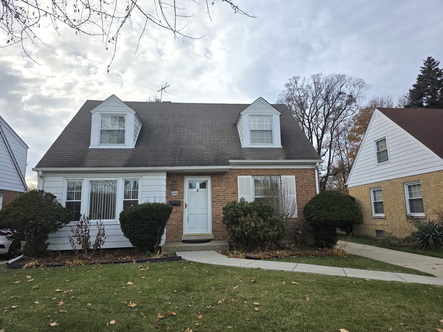 436 South Arlington Heights Road Arlington Heights, IL 60005 - Photo 2 of 16 a front view of a house with a yard and garage