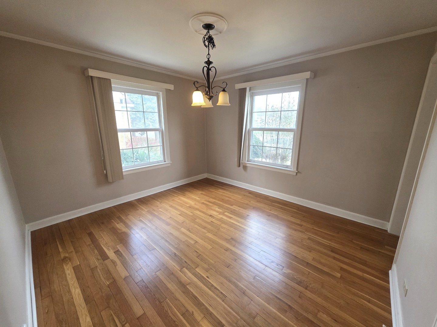 436 South Arlington Heights Road Arlington Heights, IL 60005 - Photo 6 of 16 a view of an empty room with wooden floor and a window