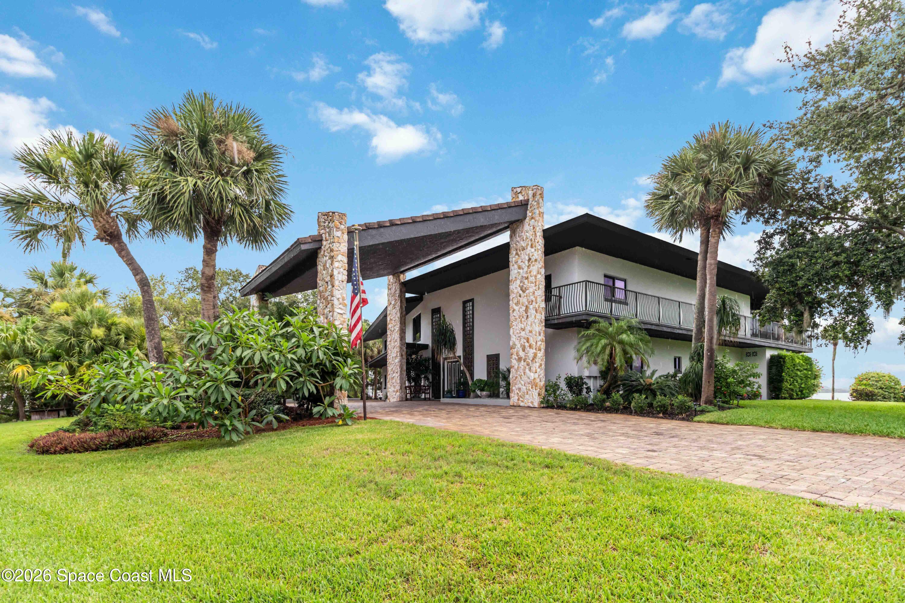 110 Barnacle Place Rockledge, FL 32955 - Photo 10 of 71 a front view of a house with a yard