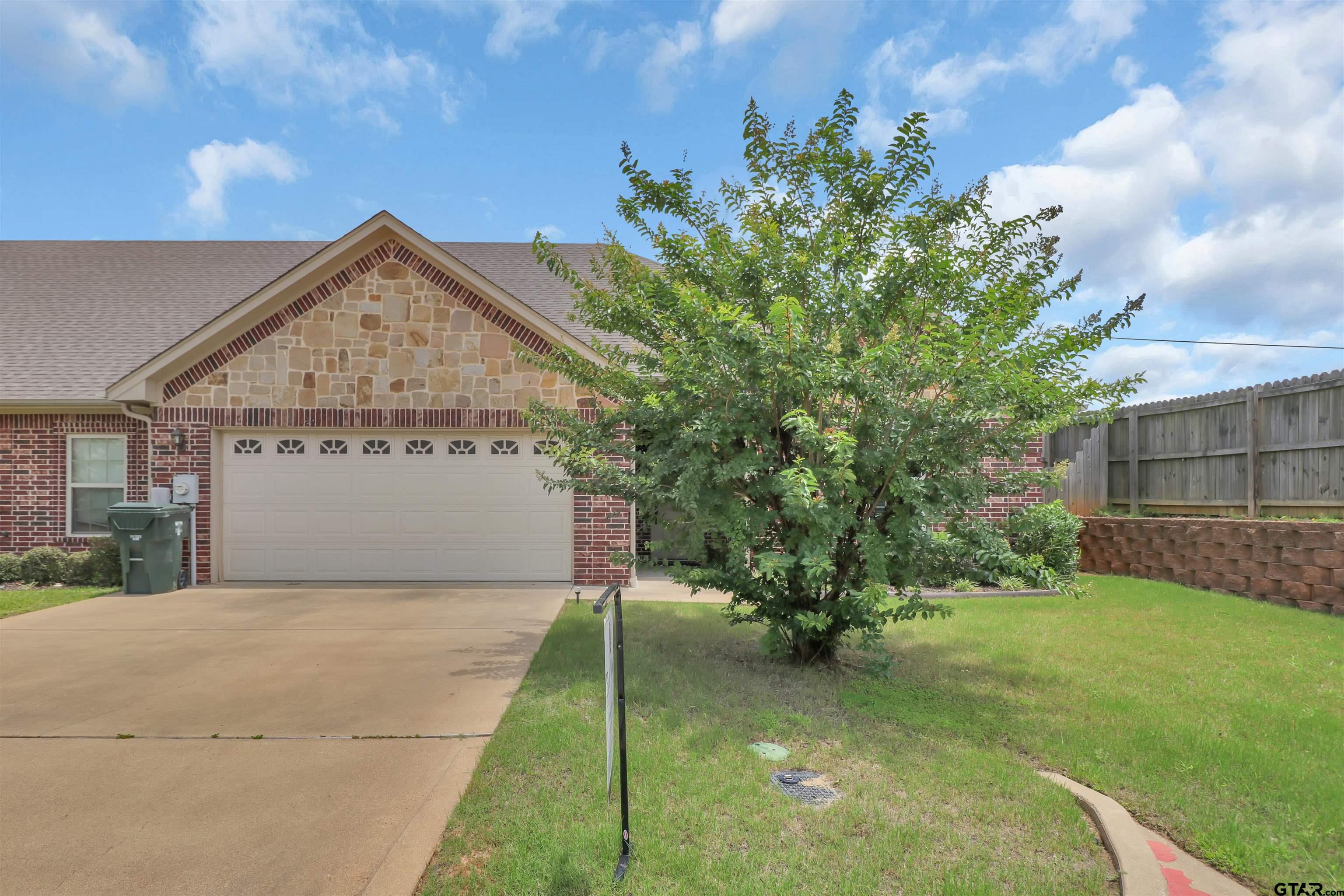 112 Letha Court Tyler, TX 75702 - Photo 2 of 45 a view of a house with a small yard and a fountain