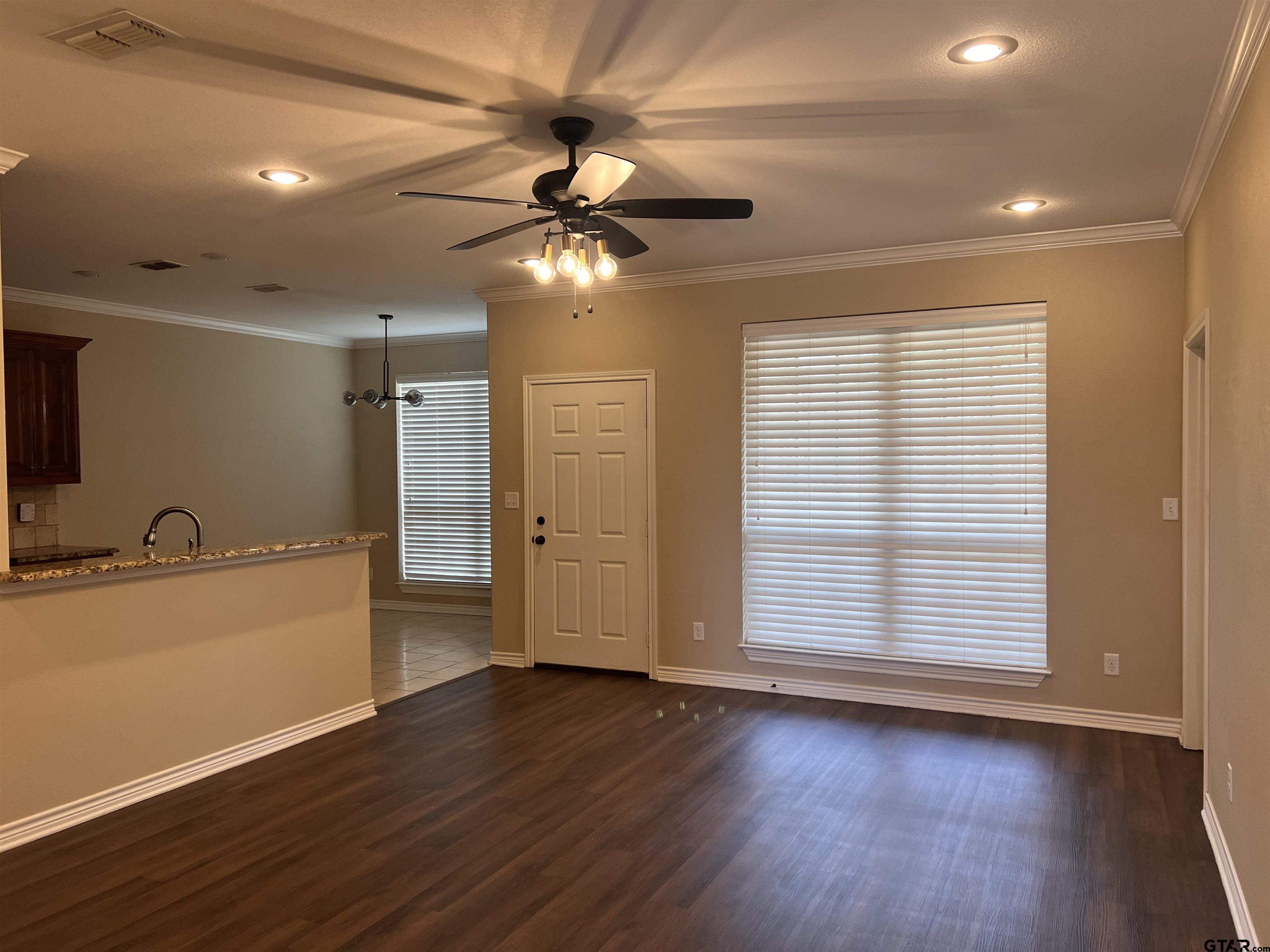 112 Letha Court Tyler, TX 75702 - Photo 38 of 45 a view of an empty room with a window and wooden floor