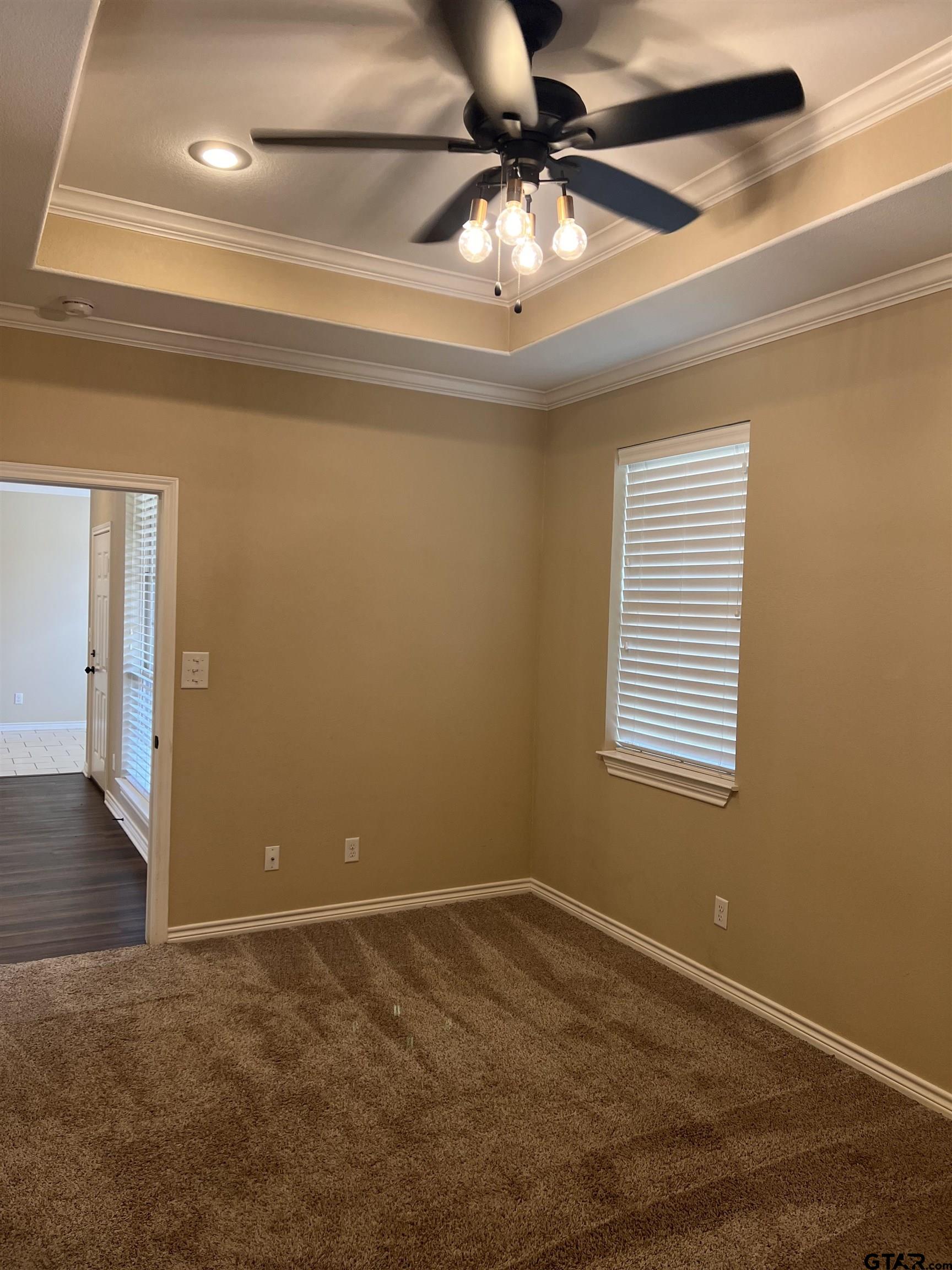112 Letha Court Tyler, TX 75702 - Photo 41 of 45 a view of a room with a ceiling fan and a window