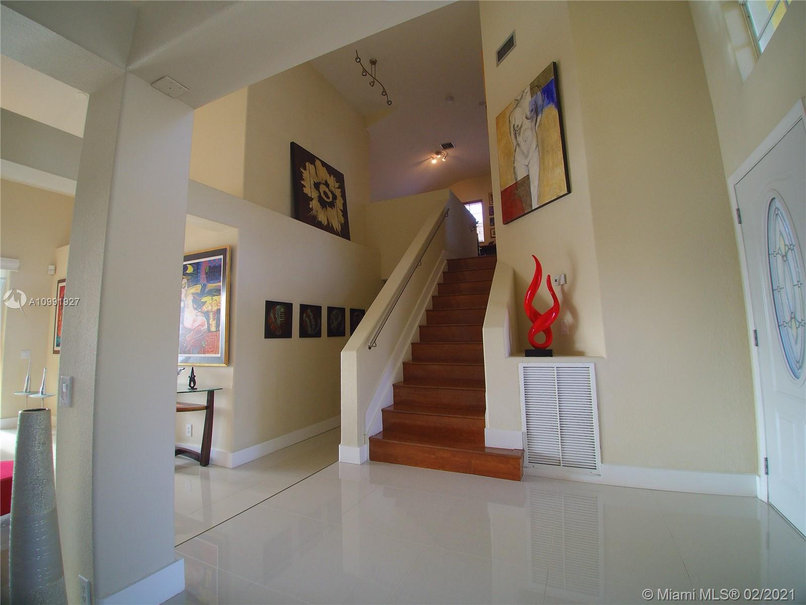 1055 San Luis Rey Weston, FL 33326 - Photo 13 of 36 a view of entryway and hall