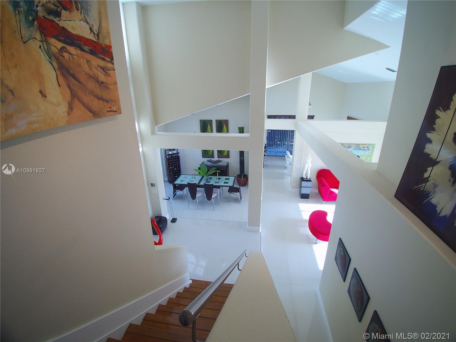 1055 San Luis Rey Weston, FL 33326 - Photo 18 of 36 a view of dining room with shelves