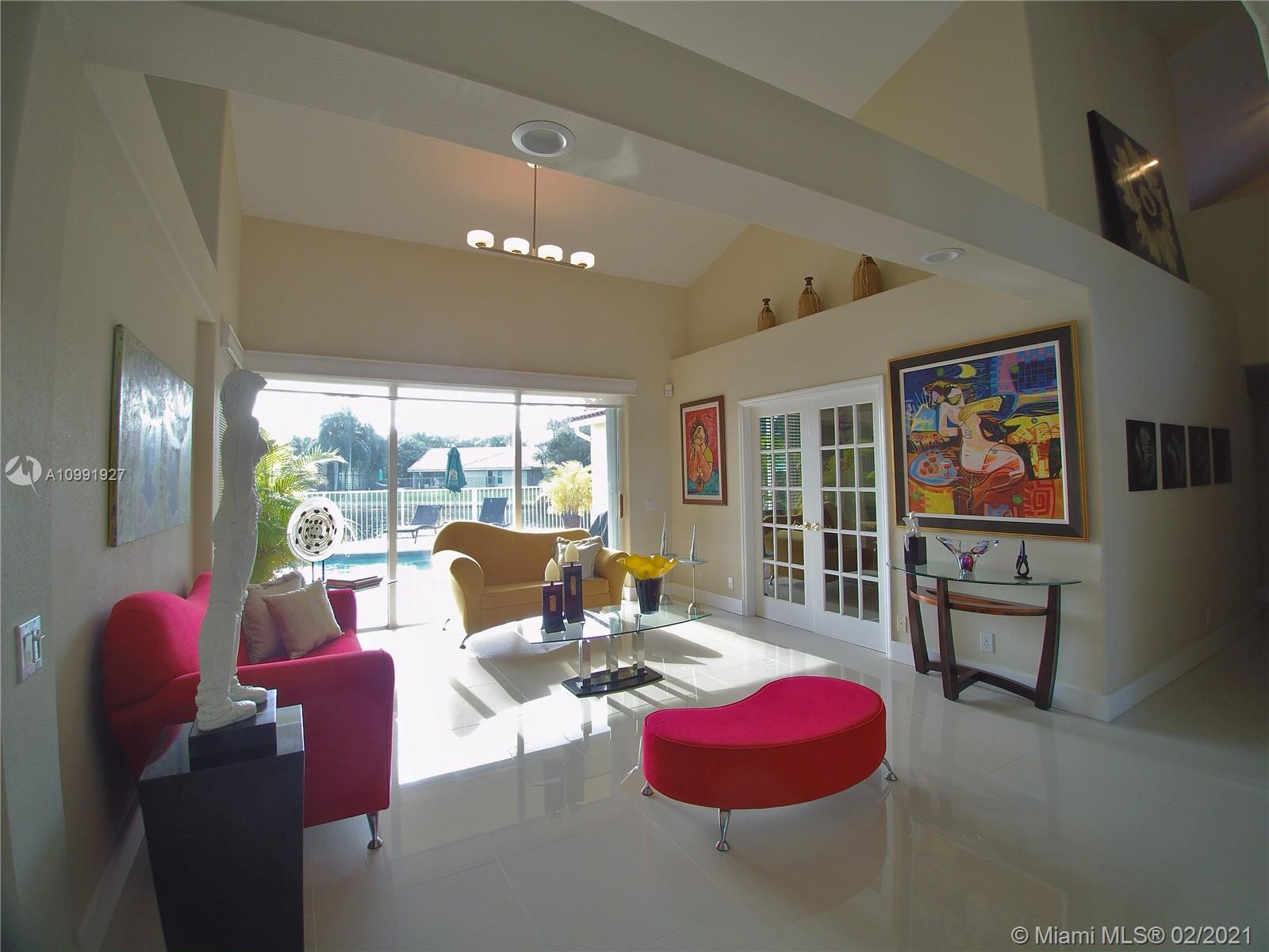 1055 San Luis Rey Weston, FL 33326 - Photo 3 of 36 a living room with furniture