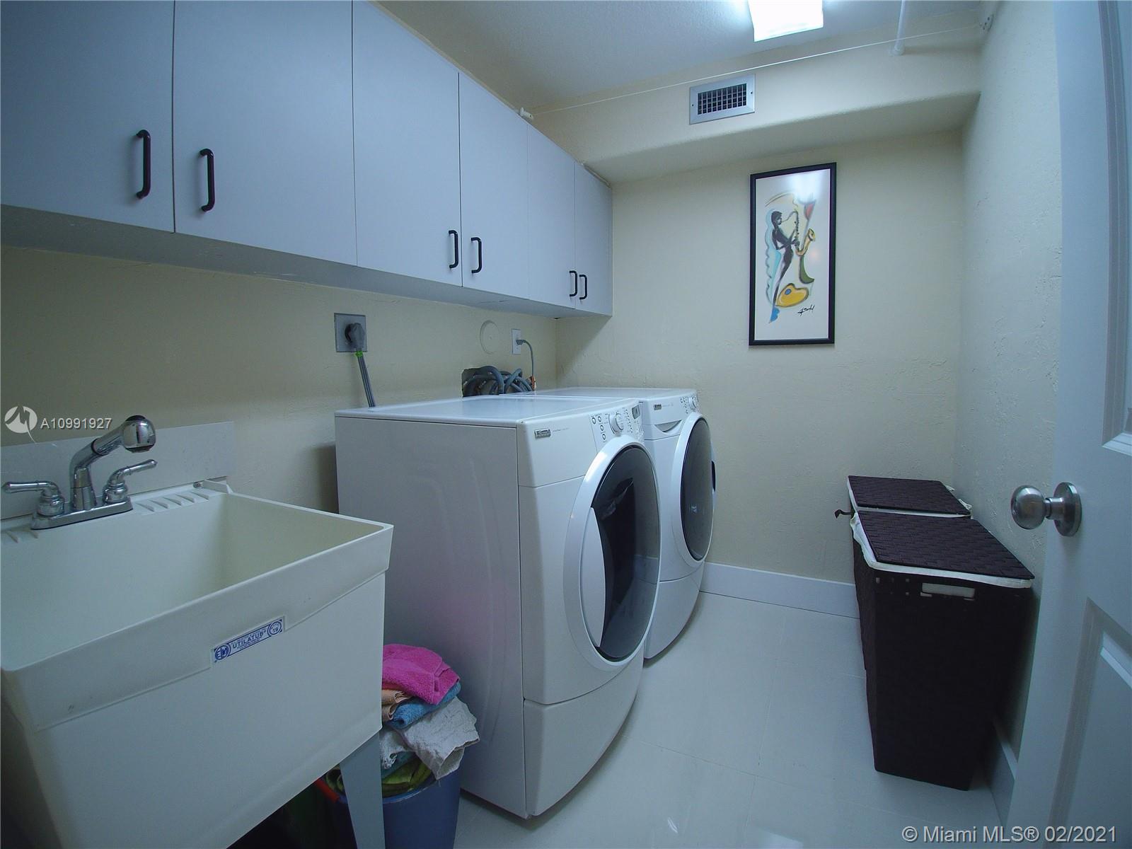 1055 San Luis Rey Weston, FL 33326 - Photo 21 of 36 a utility room with dryer and washer