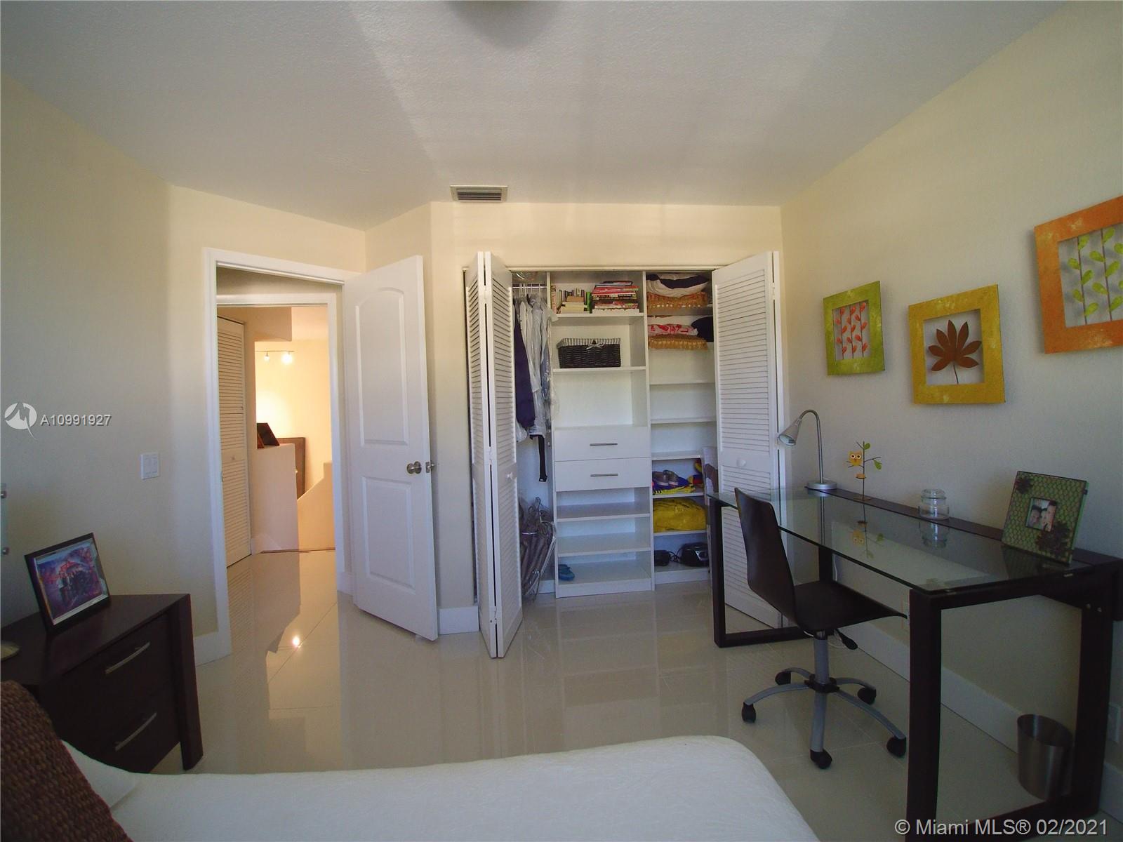 1055 San Luis Rey Weston, FL 33326 - Photo 25 of 36 a view of a hallway to a livingroom and a couch