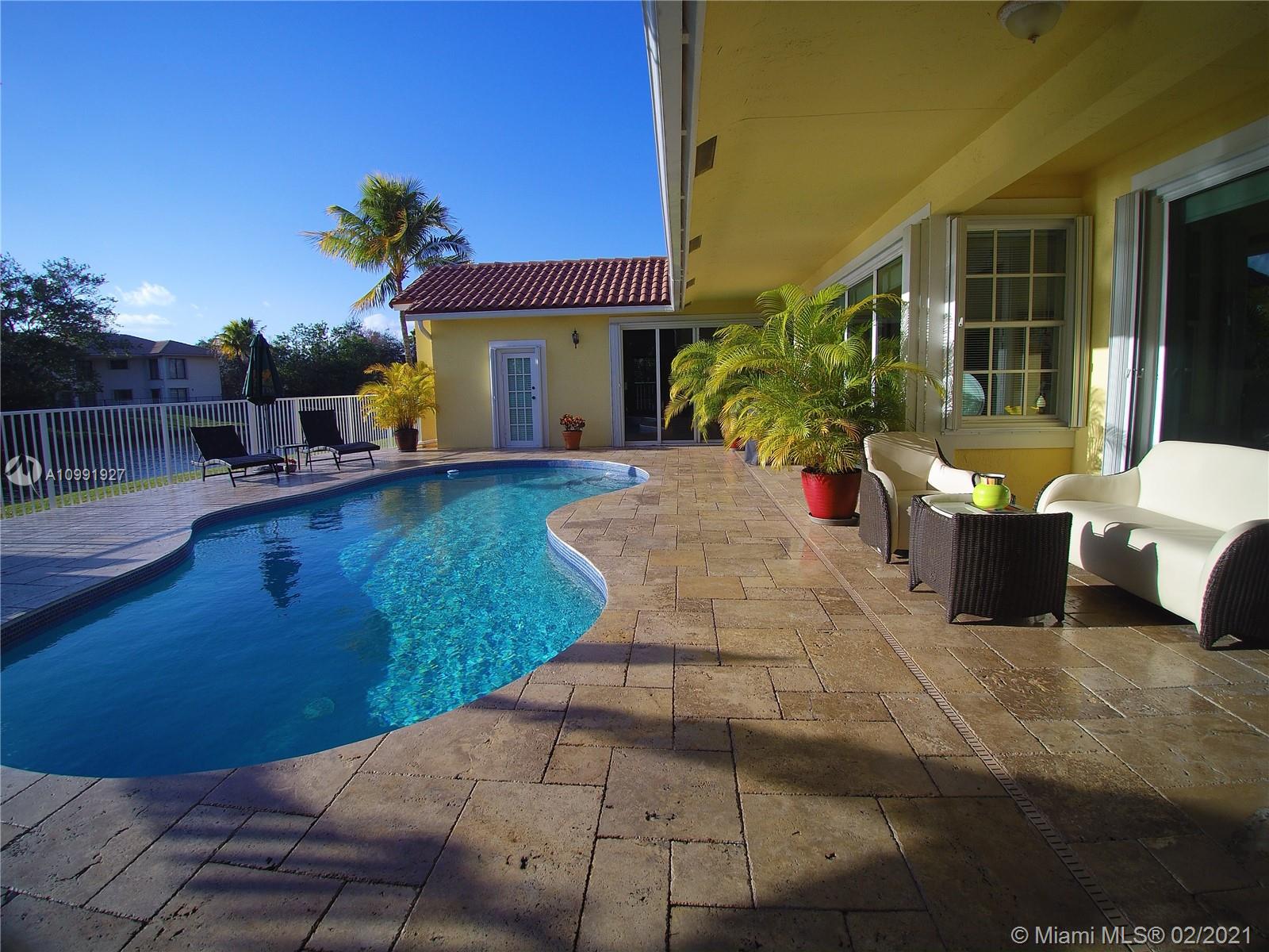 1055 San Luis Rey Weston, FL 33326 - Photo 32 of 36 a view of a house with outdoor space and sitting space