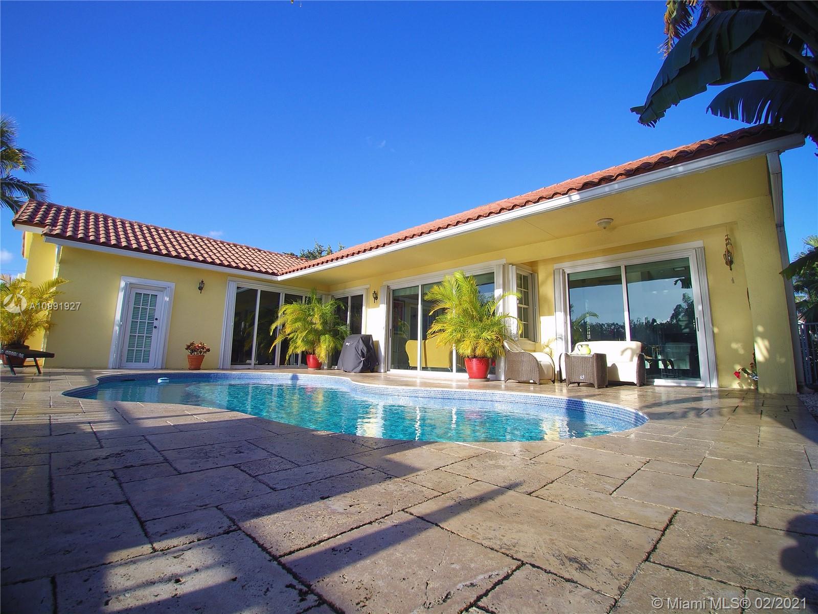 1055 San Luis Rey Weston, FL 33326 - Photo 34 of 36 a view of a house with backyard porch and sitting area