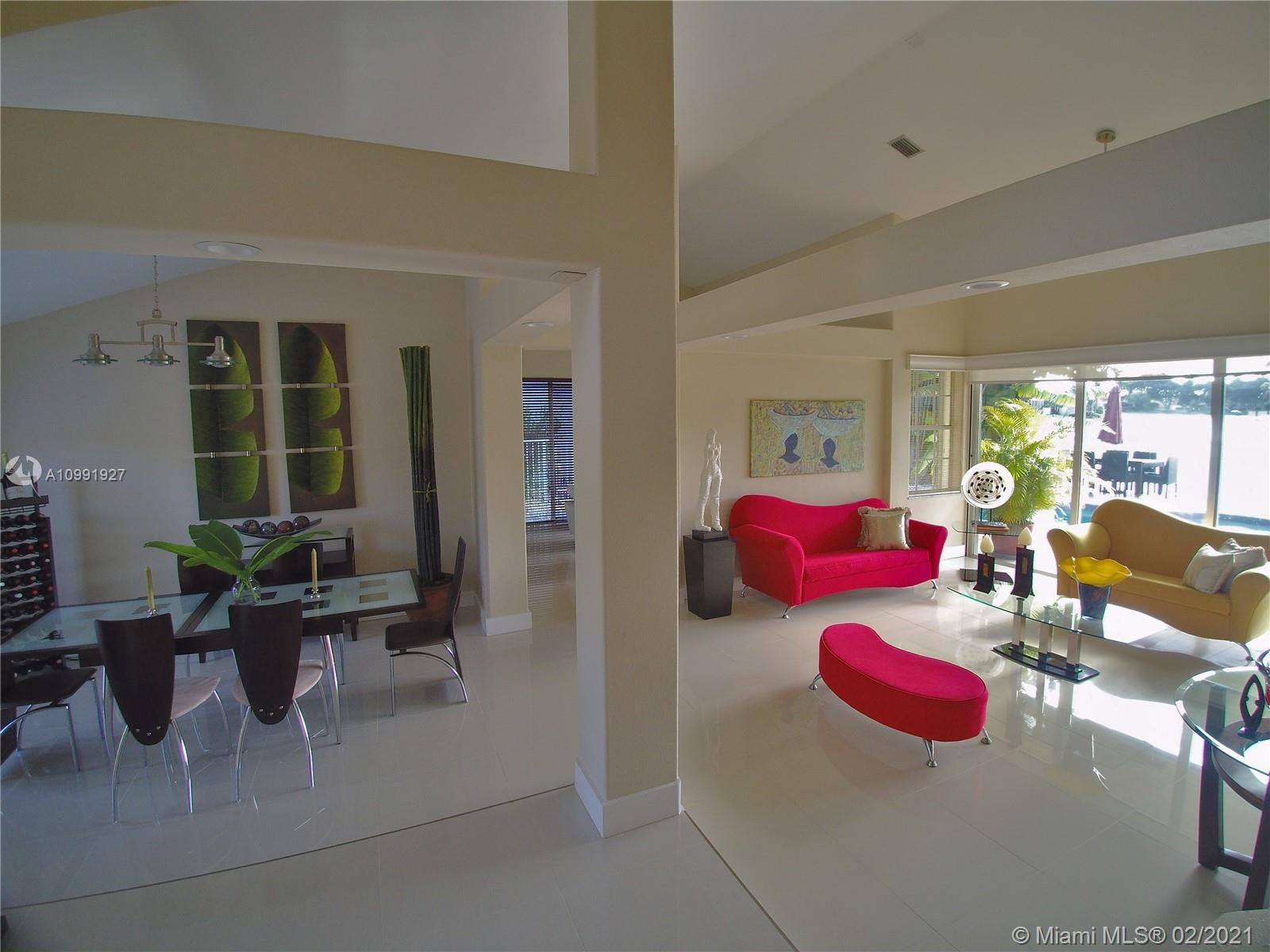 1055 San Luis Rey Weston, FL 33326 - Photo 6 of 36 a living room with furniture and a table