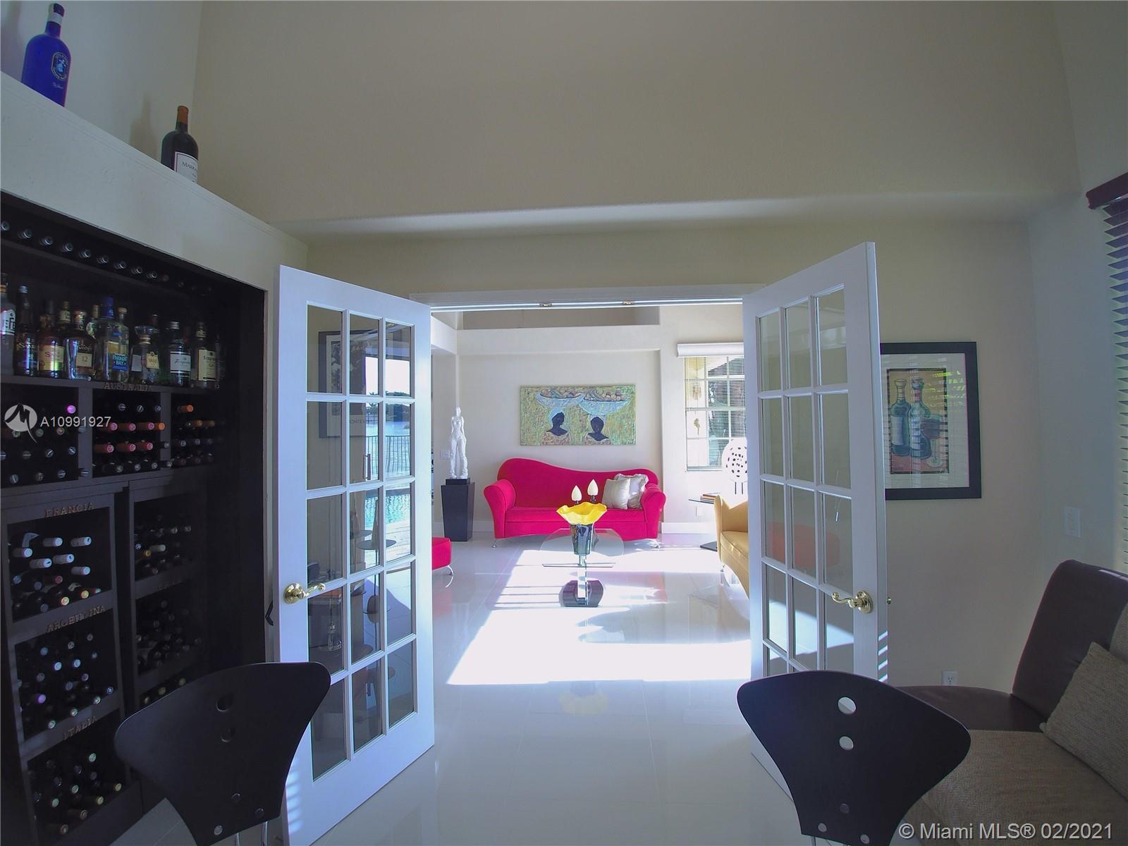 1055 San Luis Rey Weston, FL 33326 - Photo 10 of 36 a bedroom with furniture and a couch