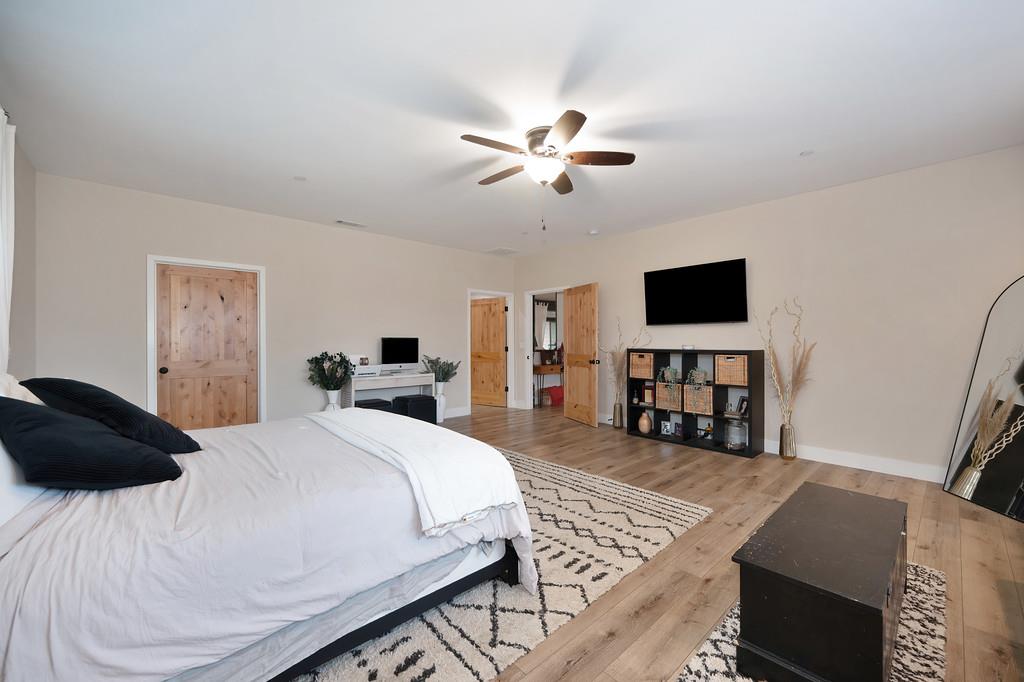 3960 Fort Jim Road Placerville, CA 95667 - Photo 37 of 64 a bedroom with a bed a television and a window