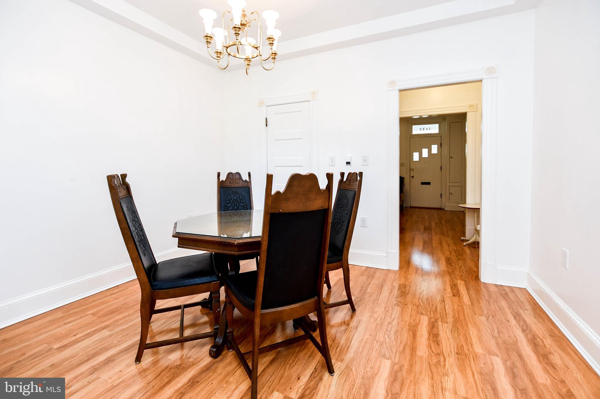 1432 C Street Southeast Washington, DC 20003 - Photo 11 of 48 a view of a dining room with furniture and wooden floor