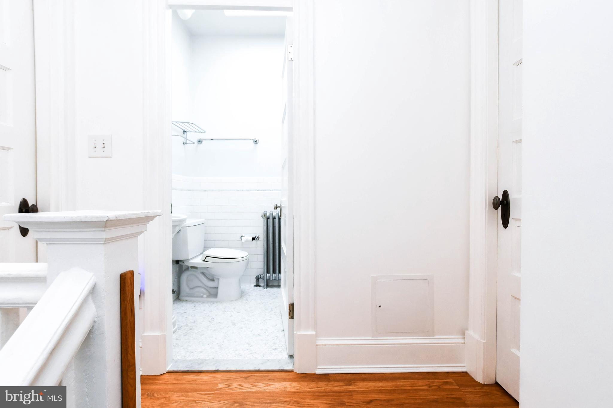 1432 C Street Southeast Washington, DC 20003 - Photo 21 of 48 a bathroom with a sink a toilet and shower