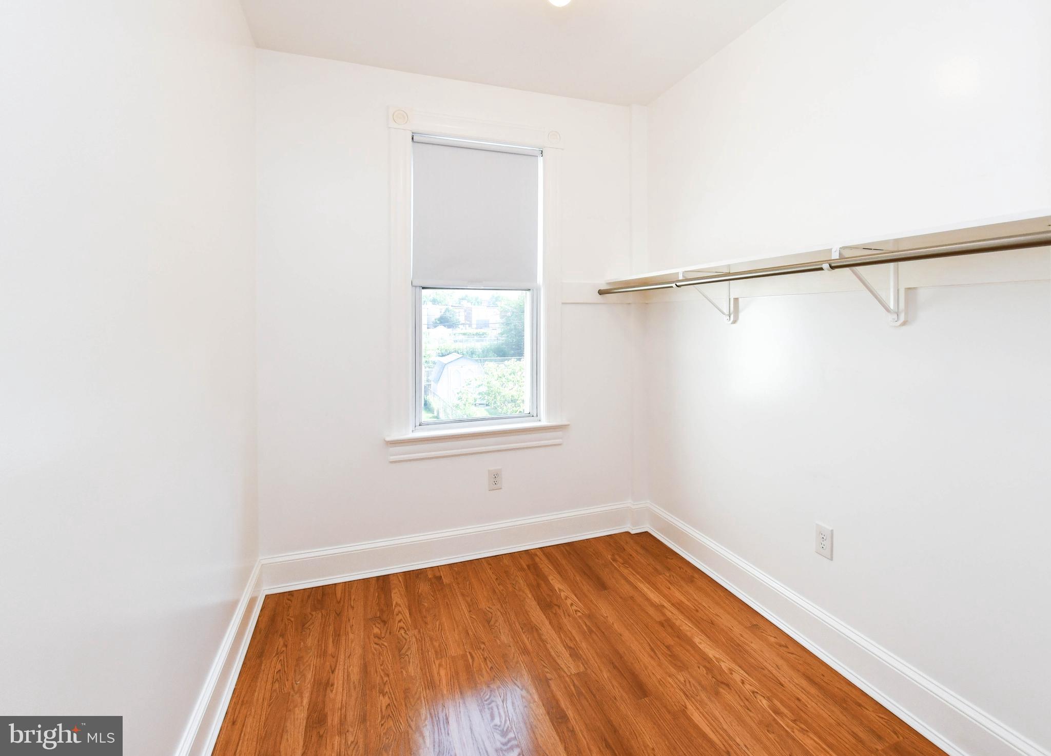1432 C Street Southeast Washington, DC 20003 - Photo 27 of 48 a view of a room with wooden floor and brick walls