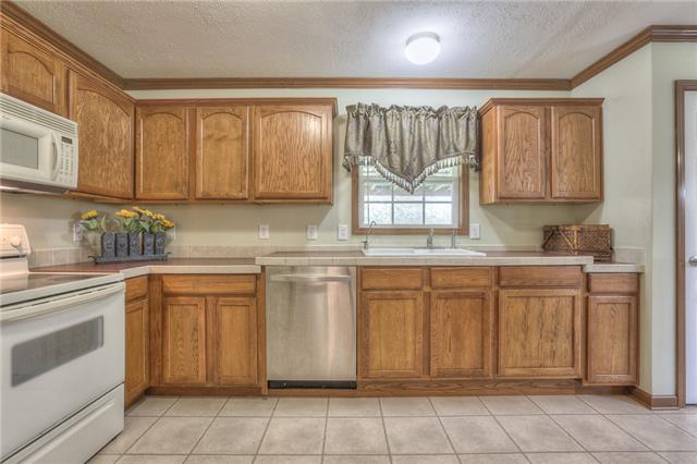 2119 Armstrong Valley Road Murfreesboro, TN 37128 - Photo 8 of 20 a kitchen with stainless steel appliances granite countertop a sink and cabinets