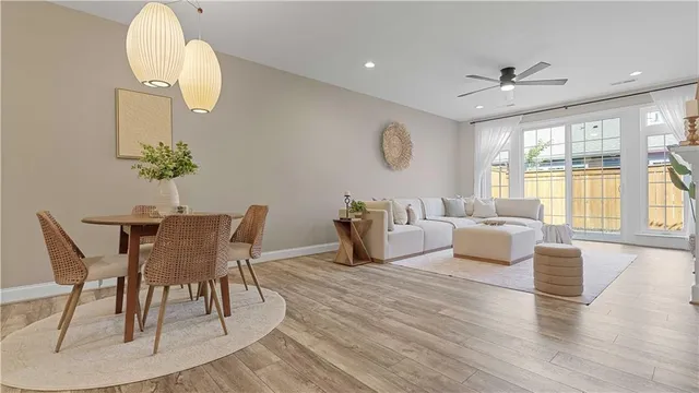 a view of a dining room with furniture and a chandelier