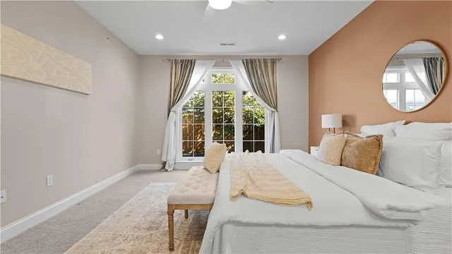 a bedroom with a bed and window