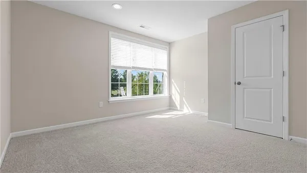 a view of an empty room and a windows