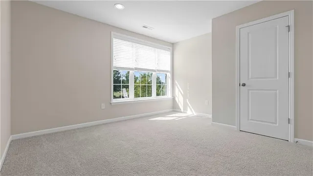 a view of an empty room and a windows