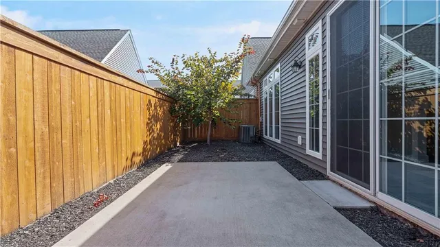 a view of a house with a yard and sitting area