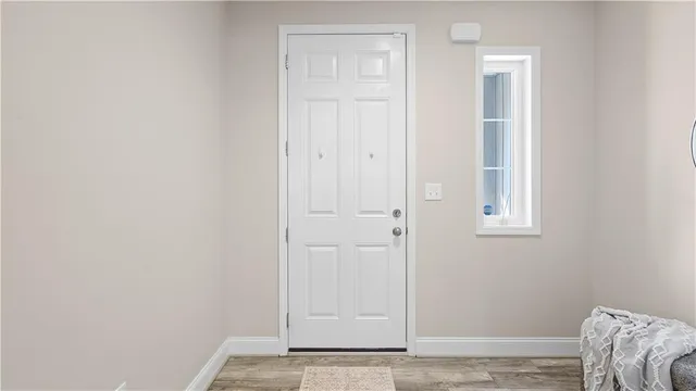 a view of a livingroom with furniture and wooden floor