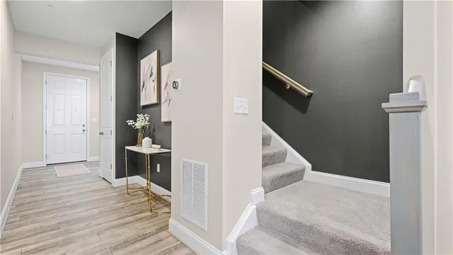 a kitchen with stainless steel appliances a refrigerator sink and cabinets