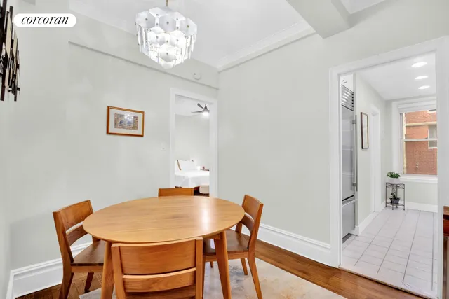 a living room with table a couch and a dining table
