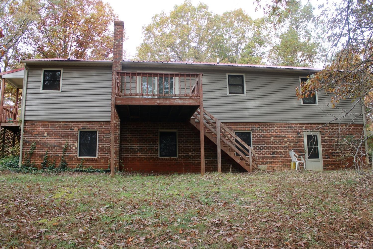 3260 West Perch Road Monroe, VA 24574 - Photo 3 of 12 a view of a house with a yard and garage