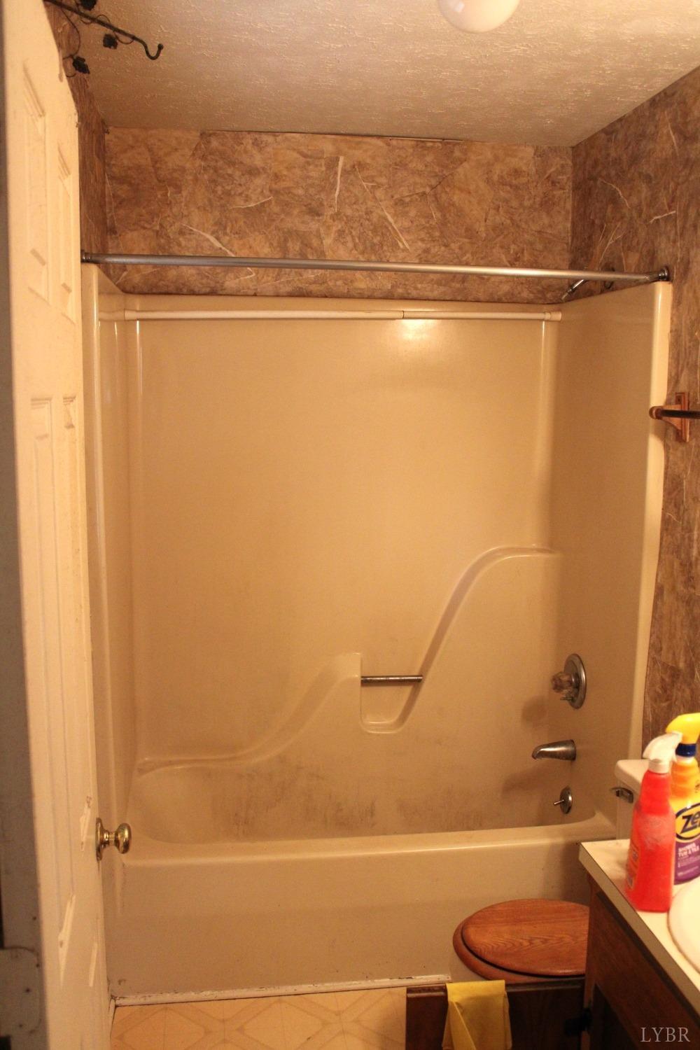 3260 West Perch Road Monroe, VA 24574 - Photo 8 of 12 a bathroom with a shower and a toilet