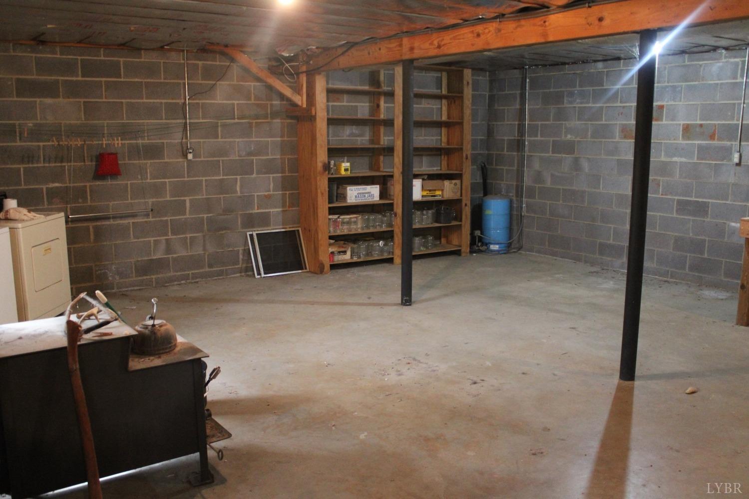 3260 West Perch Road Monroe, VA 24574 - Photo 10 of 12 a view of an empty room and fire place
