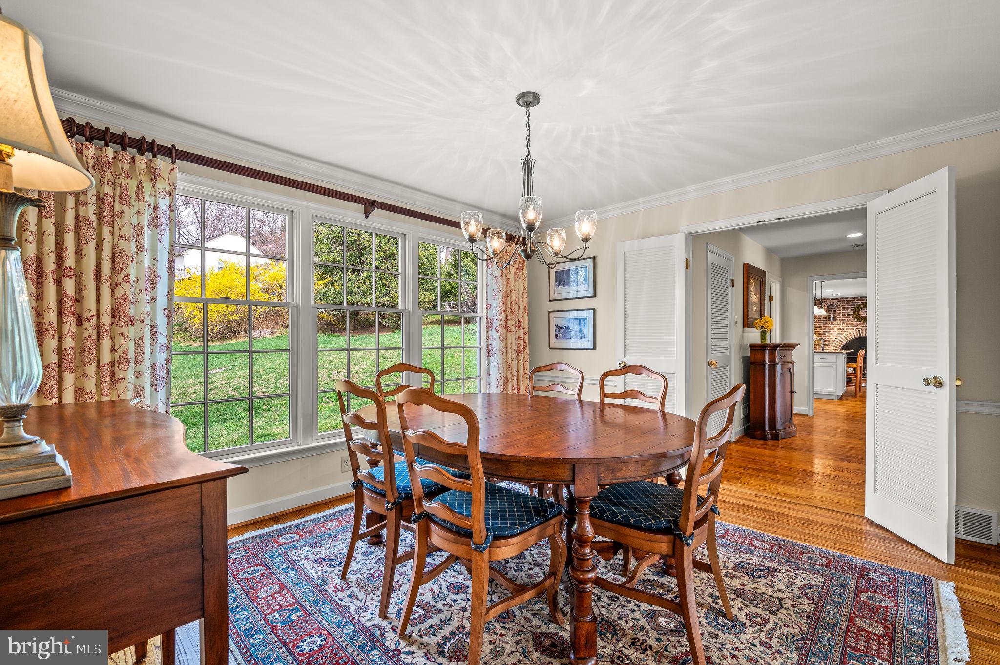 182 Grubb Road Malvern, PA 19355 - Photo 19 of 69 a dining room with furniture a chandelier and wooden floor