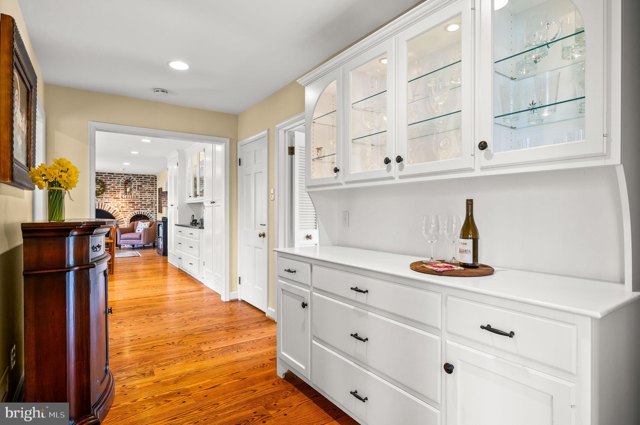 182 Grubb Road Malvern, PA 19355 - Photo 21 of 69 a hallway with white cabinets and wooden floor