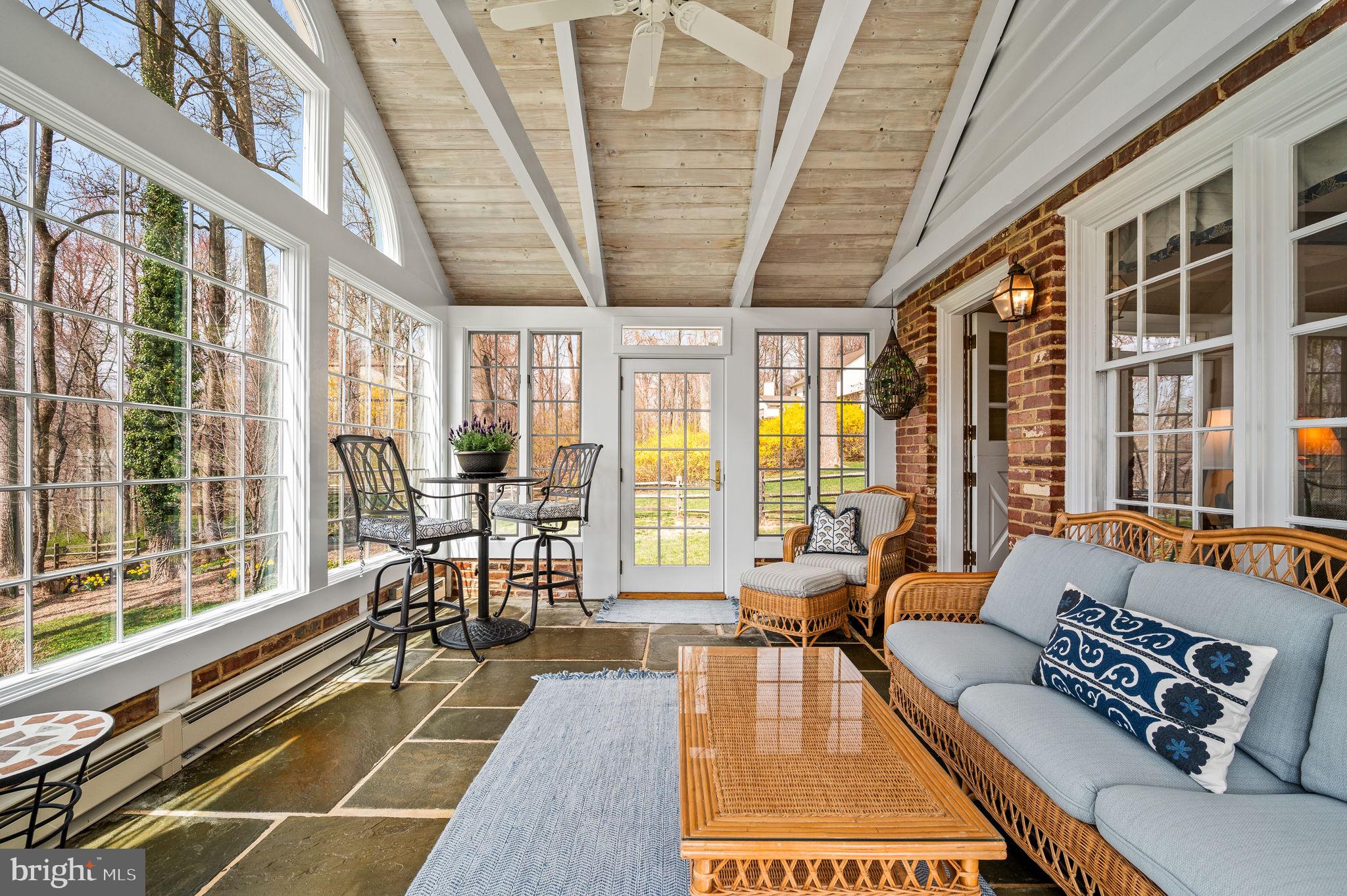182 Grubb Road Malvern, PA 19355 - Photo 26 of 69 a living room with furniture tv and large windows