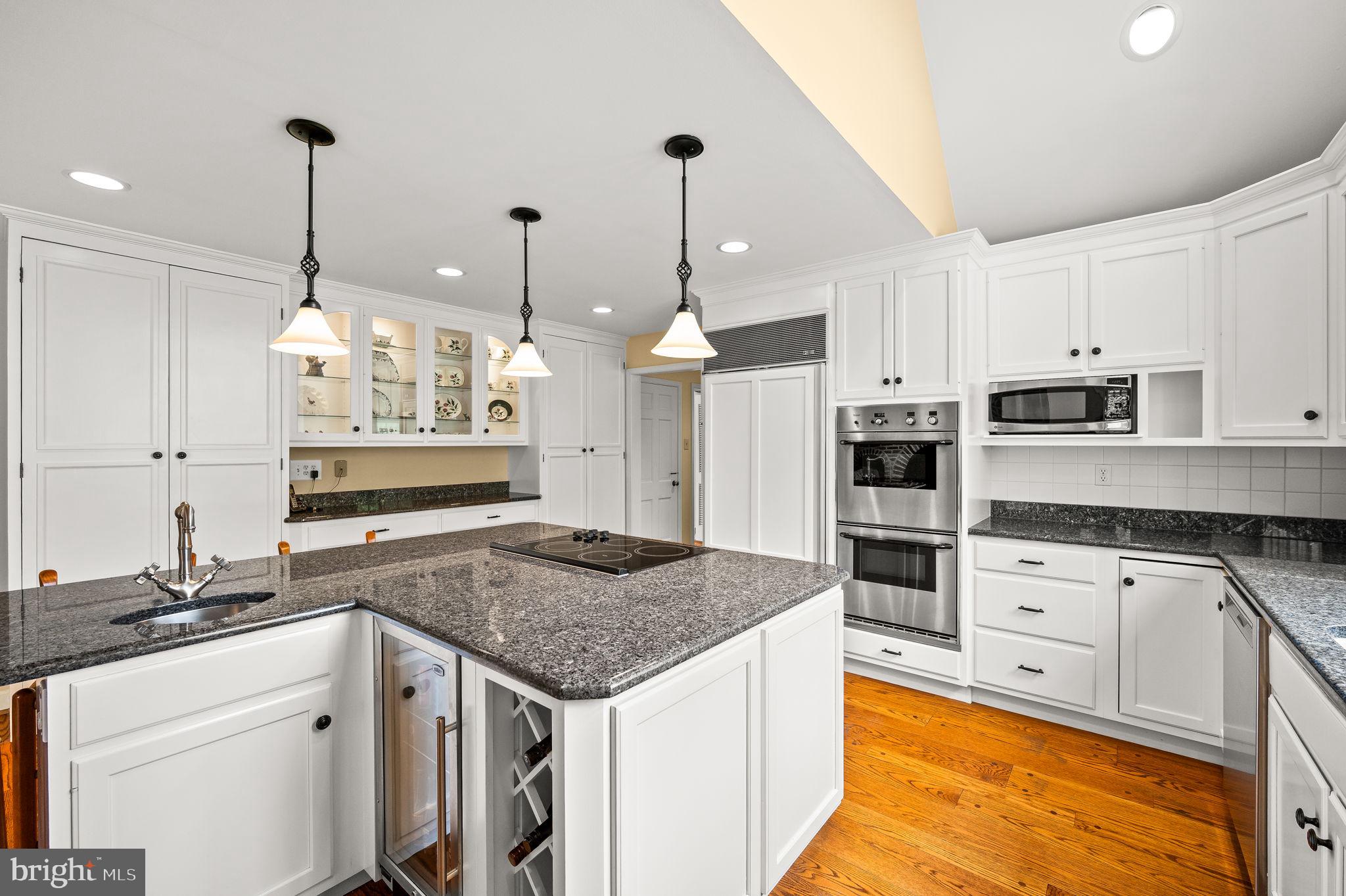 182 Grubb Road Malvern, PA 19355 - Photo 30 of 69 a kitchen with stainless steel appliances granite countertop a sink stove and refrigerator
