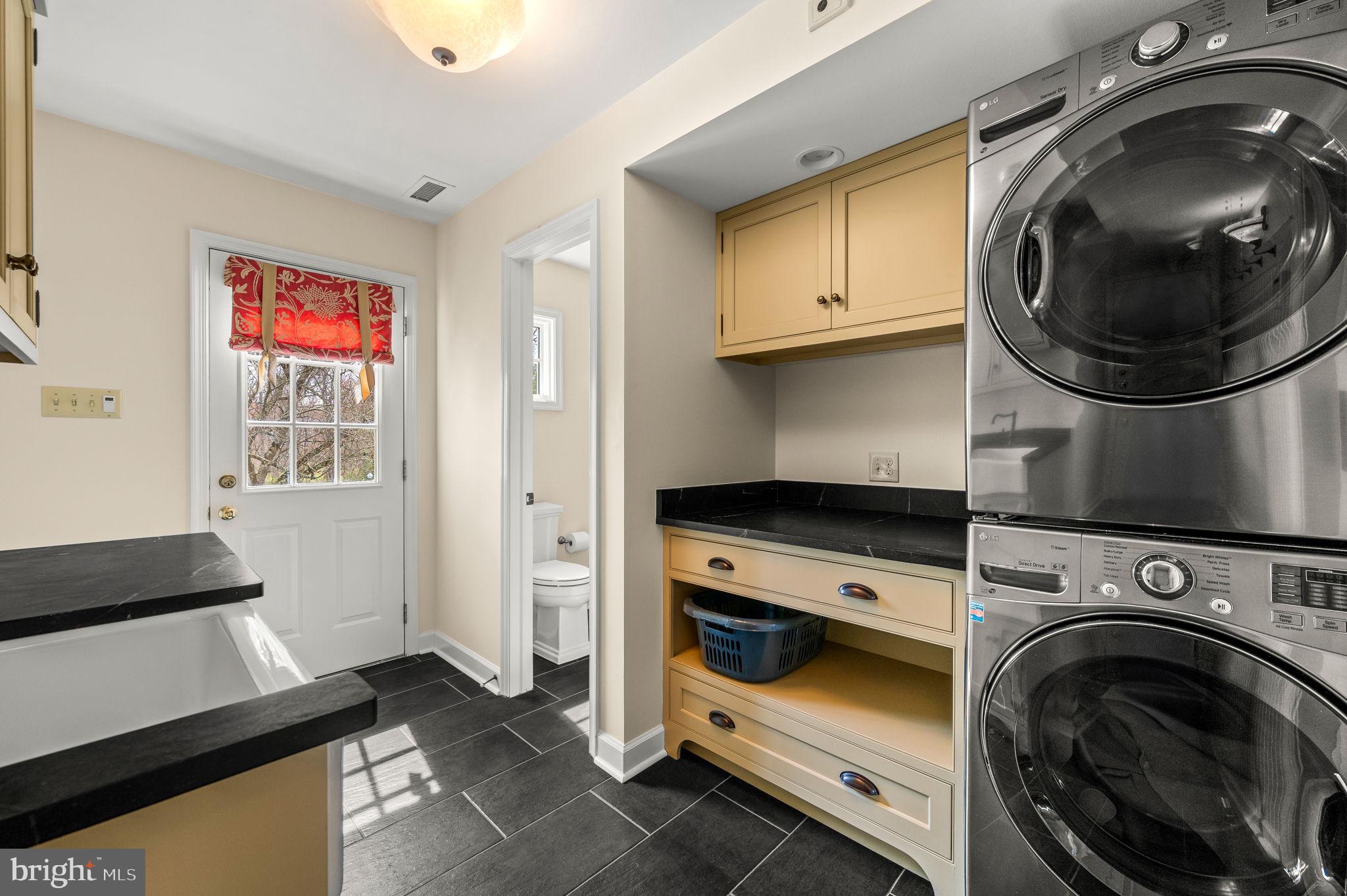 182 Grubb Road Malvern, PA 19355 - Photo 32 of 69 a utility room with sink dryer and washer
