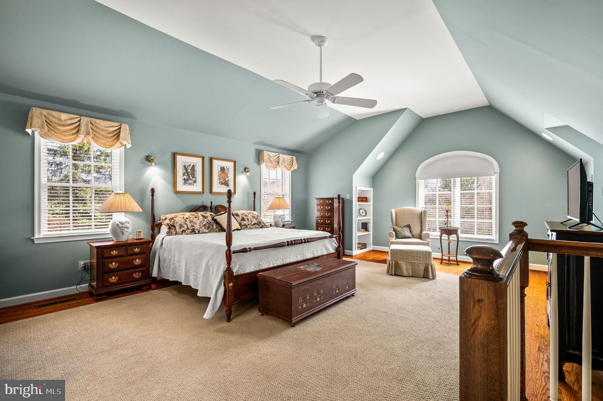 182 Grubb Road Malvern, PA 19355 - Photo 34 of 69 a living room with furniture gym equipment and a large window