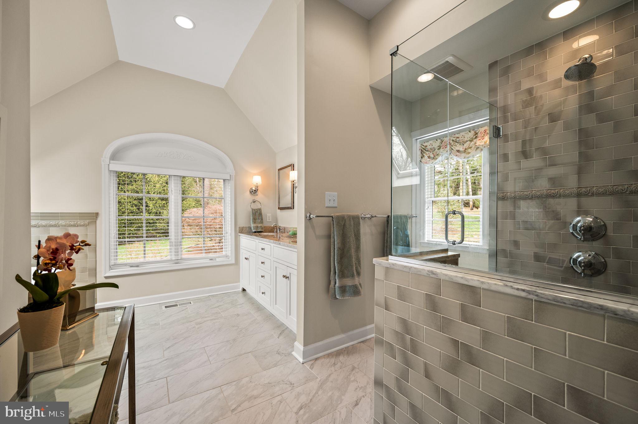 182 Grubb Road Malvern, PA 19355 - Photo 38 of 69 a spacious bathroom with a double vanity sink a mirror and next to a window