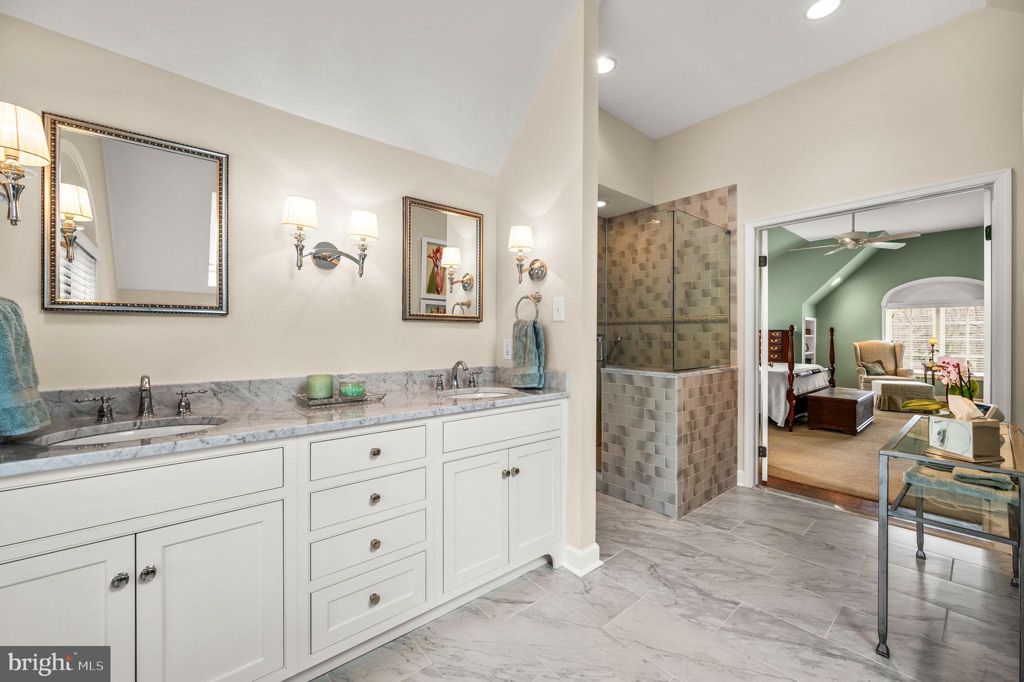 182 Grubb Road Malvern, PA 19355 - Photo 41 of 69 a spacious bathroom with a granite countertop sink mirror and shower