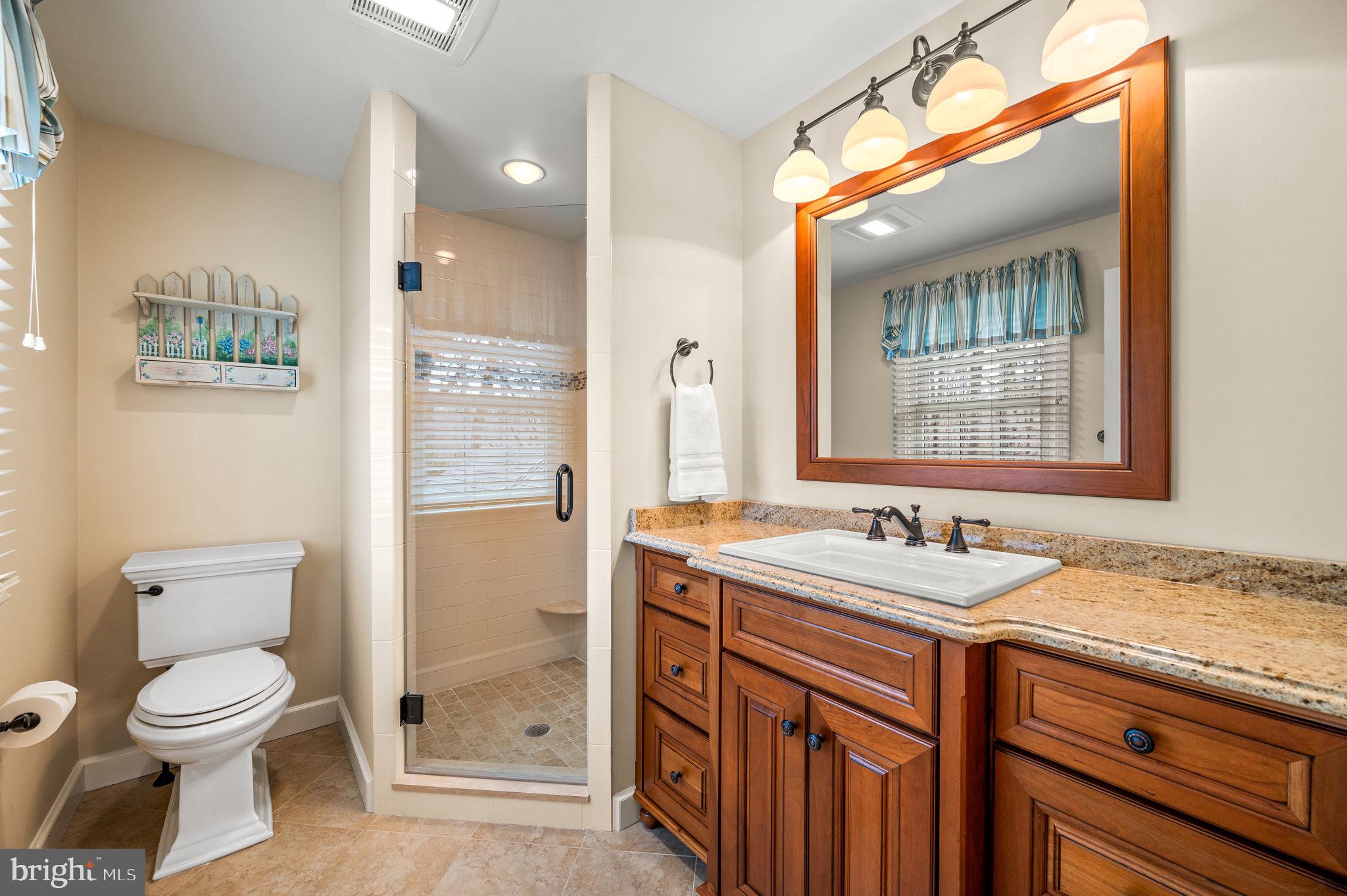 182 Grubb Road Malvern, PA 19355 - Photo 51 of 69 a bathroom with a granite countertop sink toilet and shower