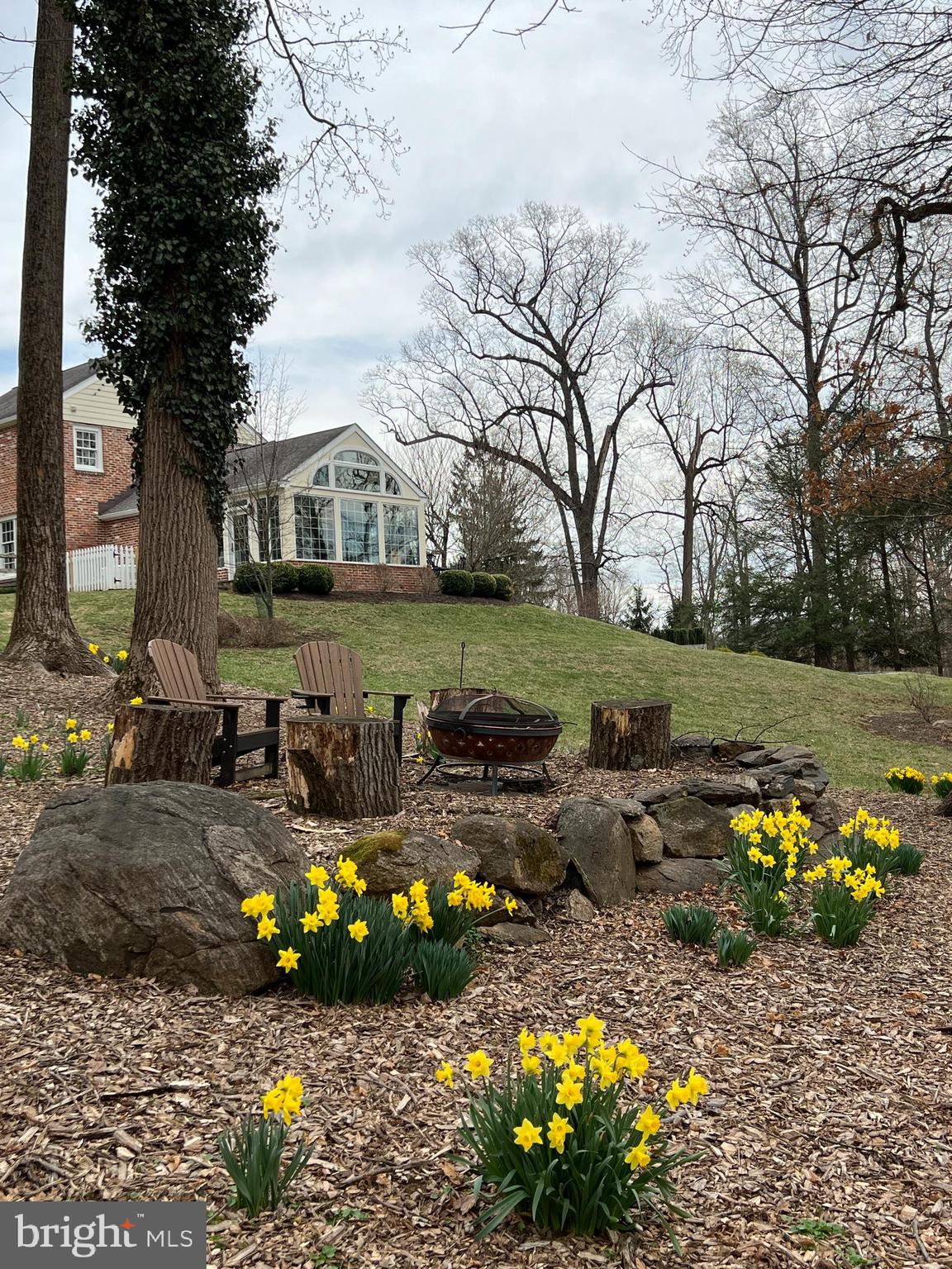 182 Grubb Road Malvern, PA 19355 - Photo 59 of 69 Firepit Area with daffodils in bloom