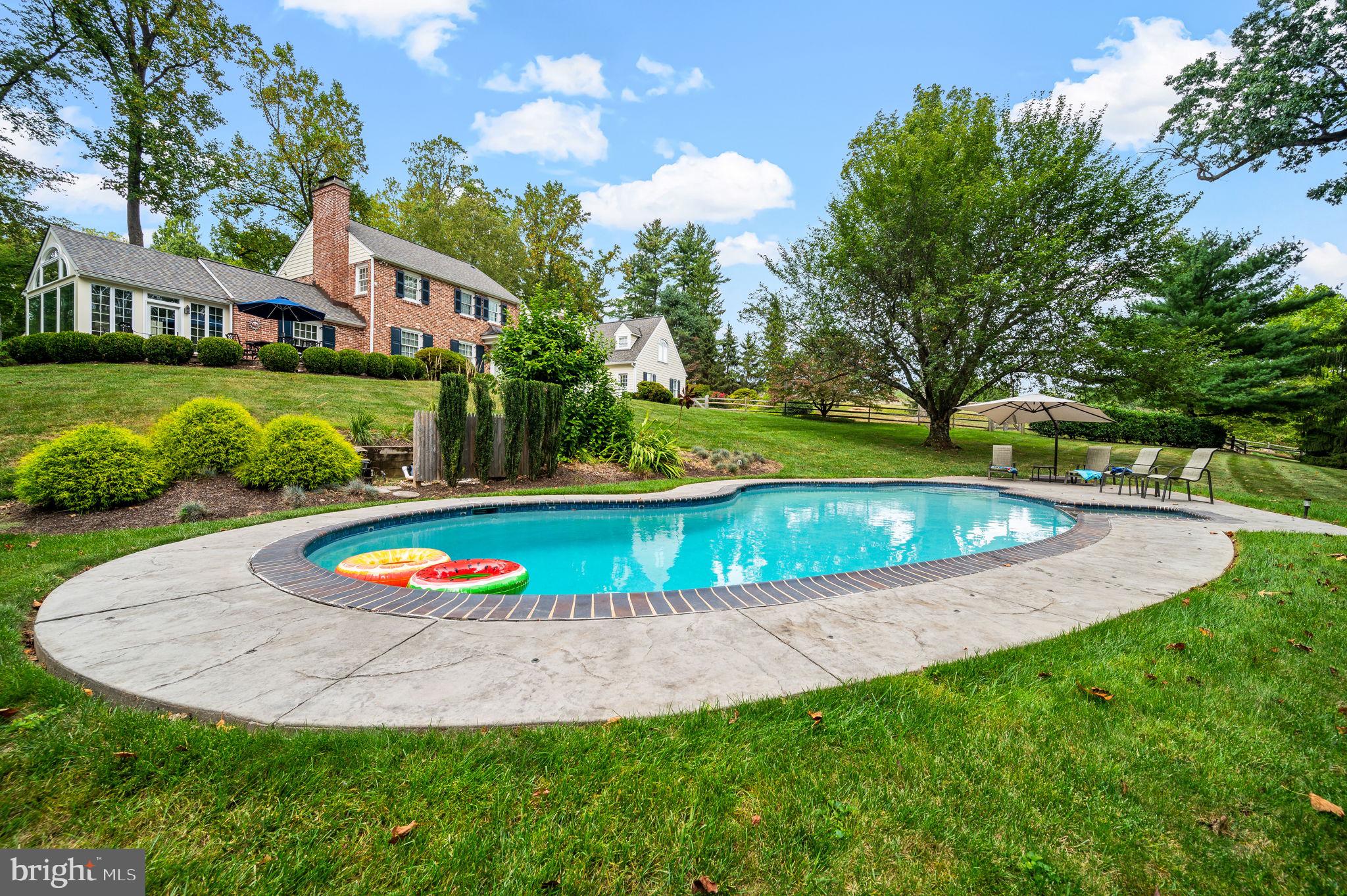 182 Grubb Road Malvern, PA 19355 - Photo 60 of 69 a view of a swimming pool with a garden