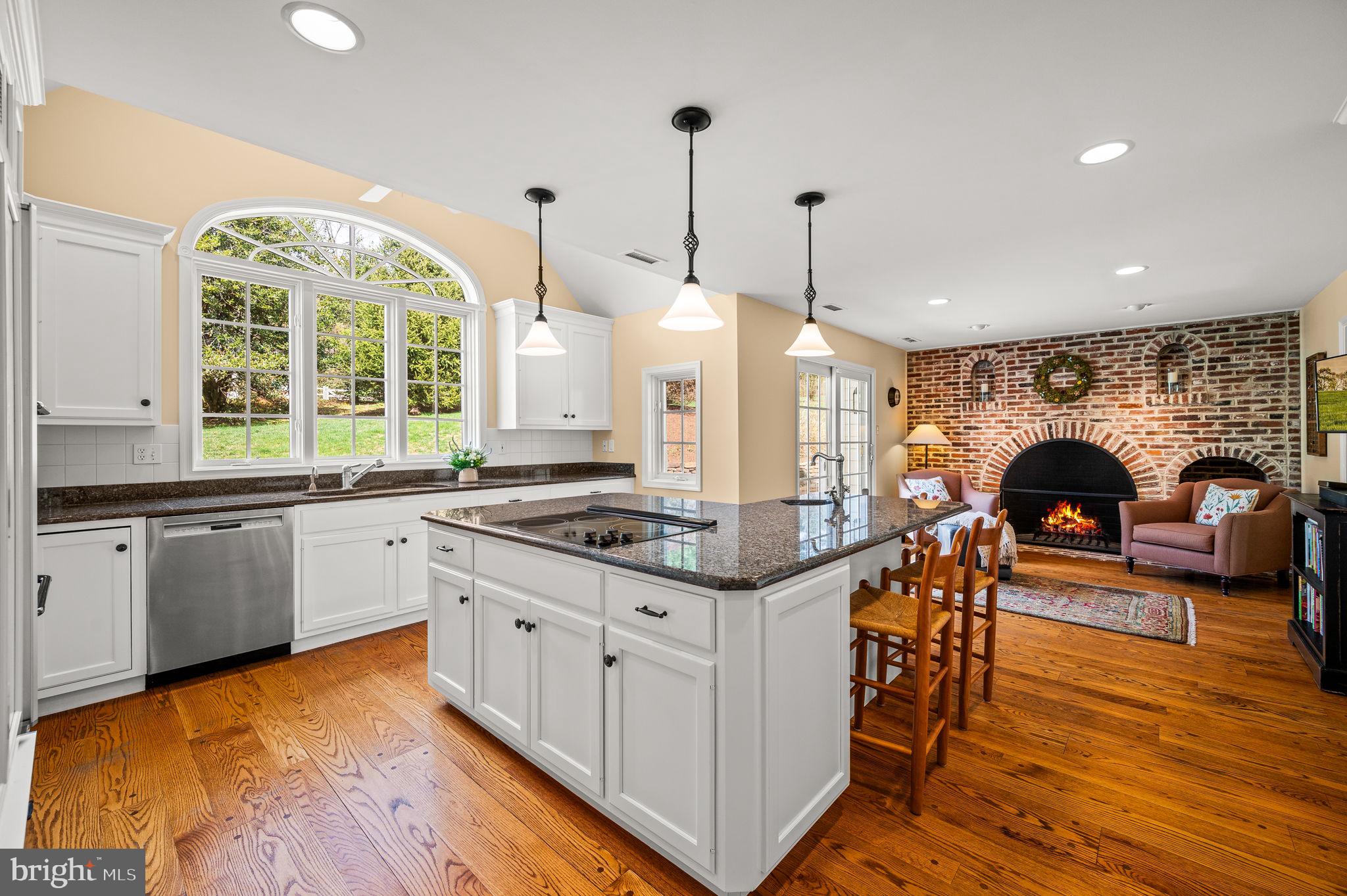 182 Grubb Road Malvern, PA 19355 - Photo 6 of 69 a kitchen with stainless steel appliances granite countertop a stove and a view of living room