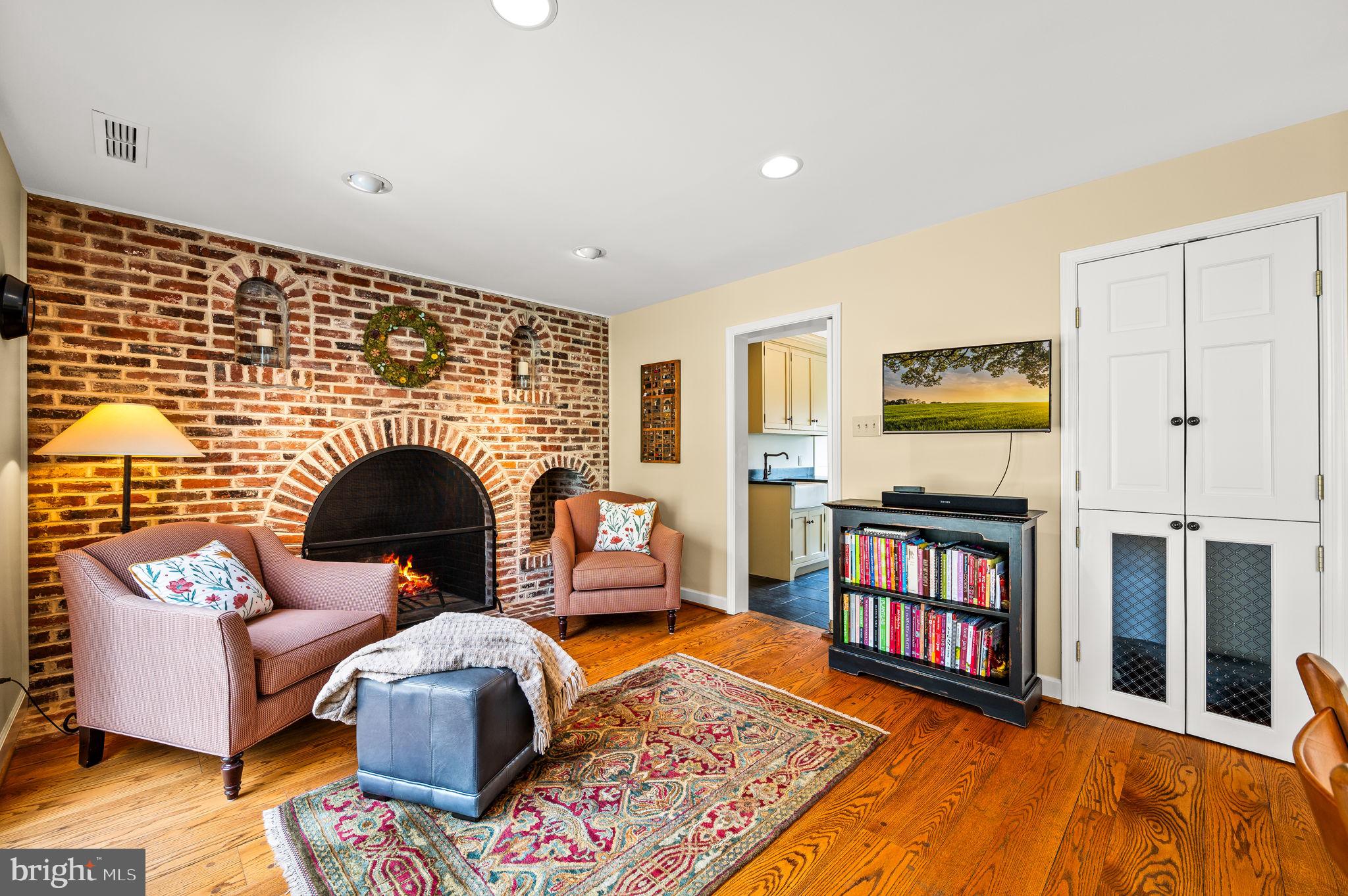 182 Grubb Road Malvern, PA 19355 - Photo 9 of 69 a living room with furniture fireplace and book shelf