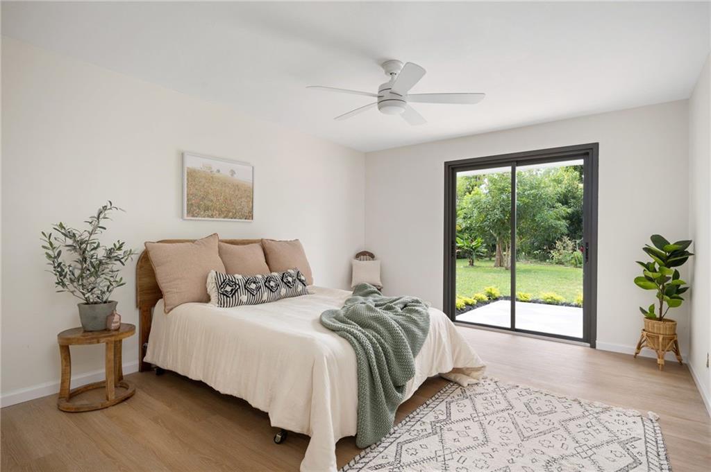 2575 15th Street Vero Beach, FL 32960 - Photo 19 of 36 a spacious bedroom with a bed and a window