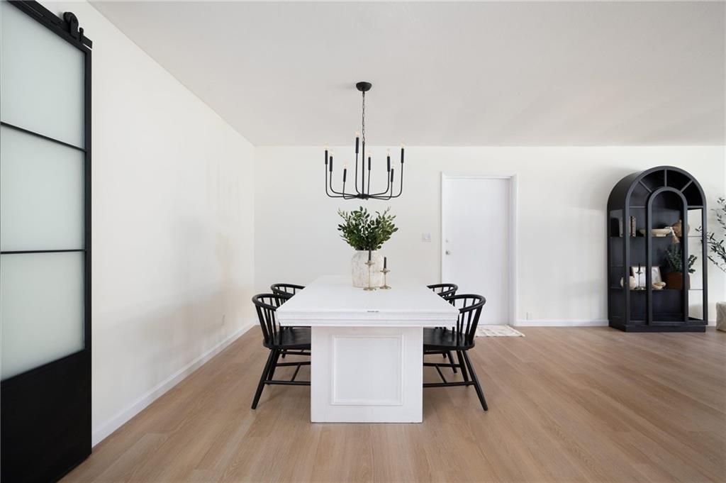 2575 15th Street Vero Beach, FL 32960 - Photo 27 of 36 a view of a dining room with furniture and wooden floor