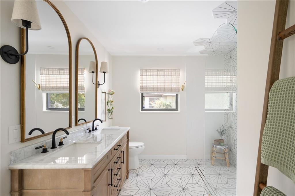 2575 15th Street Vero Beach, FL 32960 - Photo 3 of 36 a bathroom with a sink toilet and shower